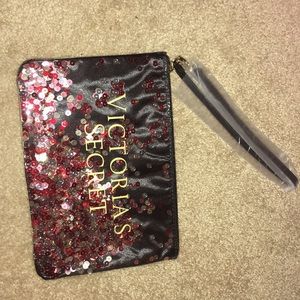 Sequin Filled Black Wristlet Bag.